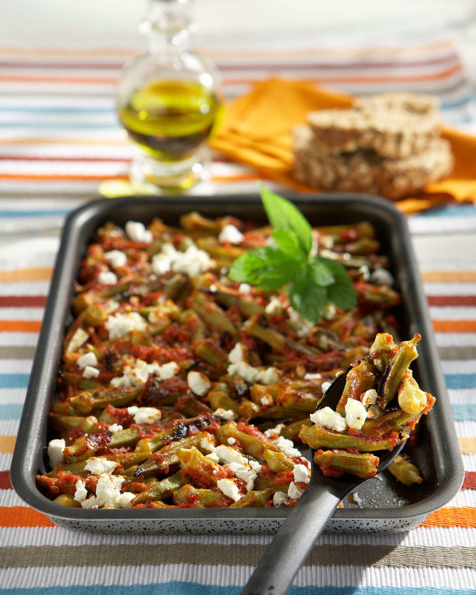 photo with Baked bamias with tomato, mint and feta cheese